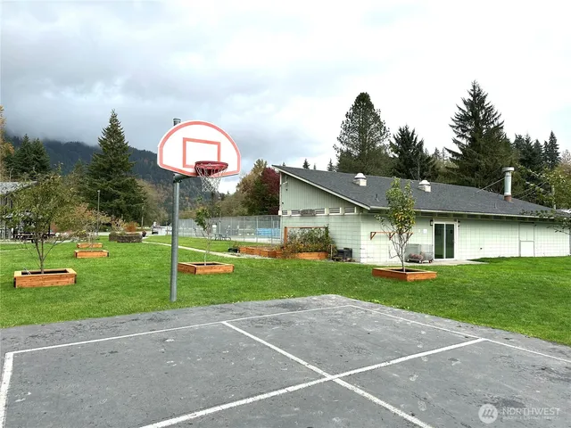 a view of a house with a yard and a patio
