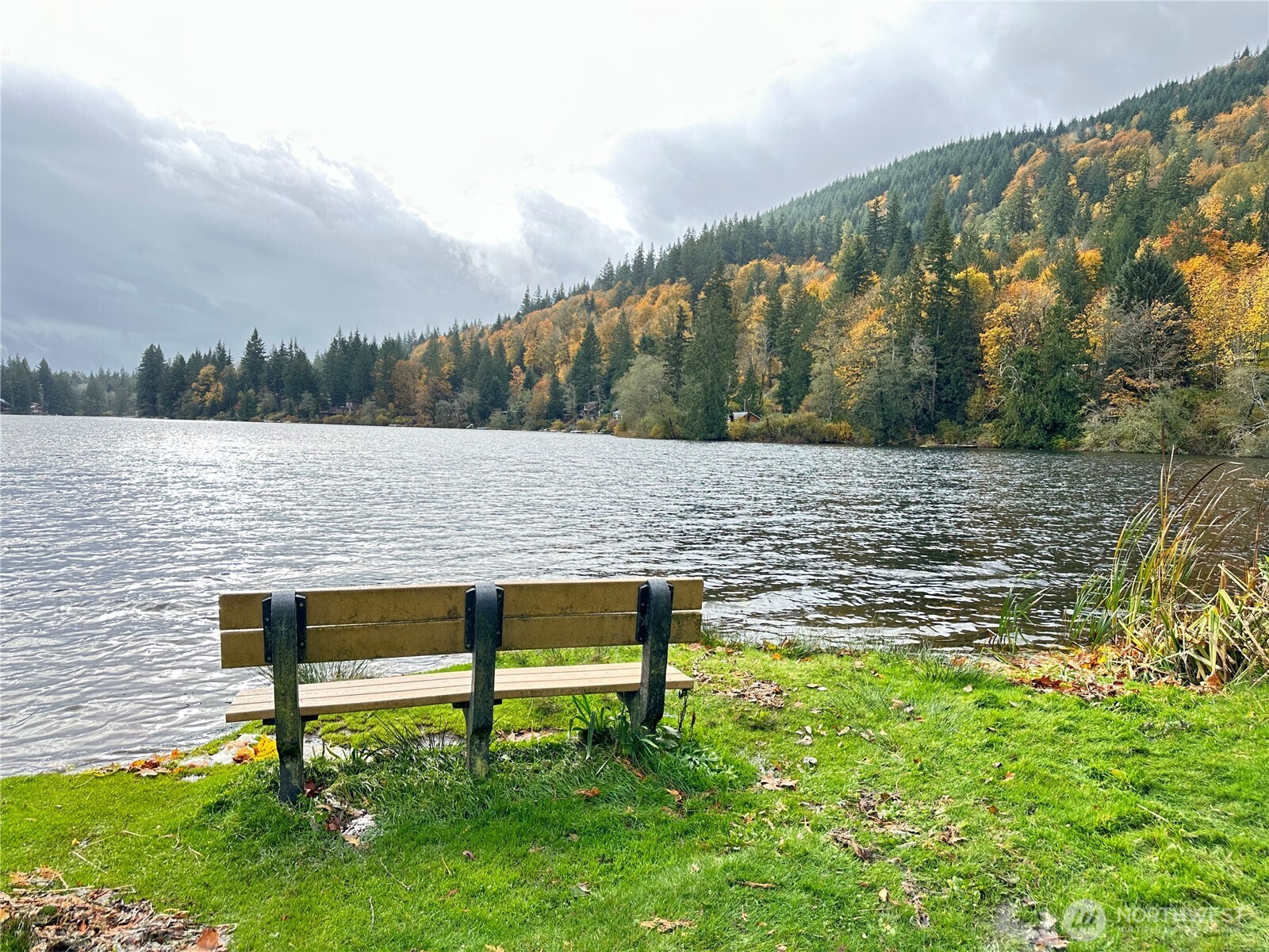 1 West Alder Drive Sedro-Woolley, WA 98284 - Photo 10 of 10 a view of lake with outdoor seating and covered with trees in the background