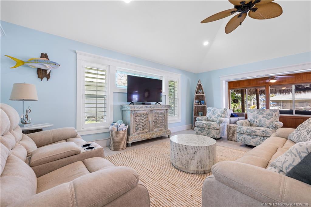 1359 Southwest Dyer Point Road Palm City, FL 34990 - Photo 9 of 55 a living room with furniture and a flat screen tv