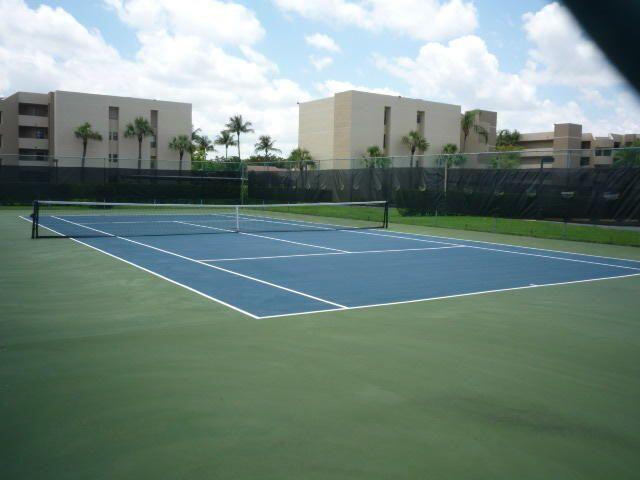 5700 Camino Del Sol, Unit 201 Boca Raton, FL 33433 - Photo 13 of 17 a view of a tennis court