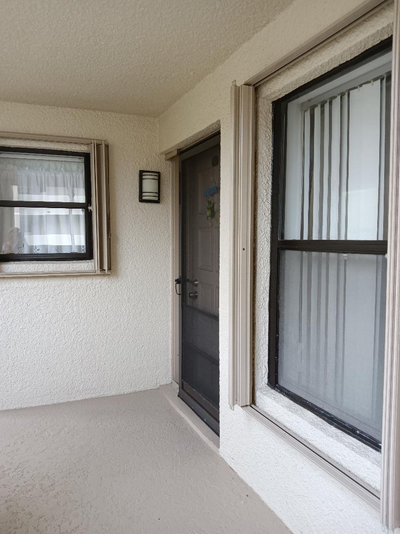 5700 Camino Del Sol, Unit 201 Boca Raton, FL 33433 - Photo 4 of 17 a view of front door