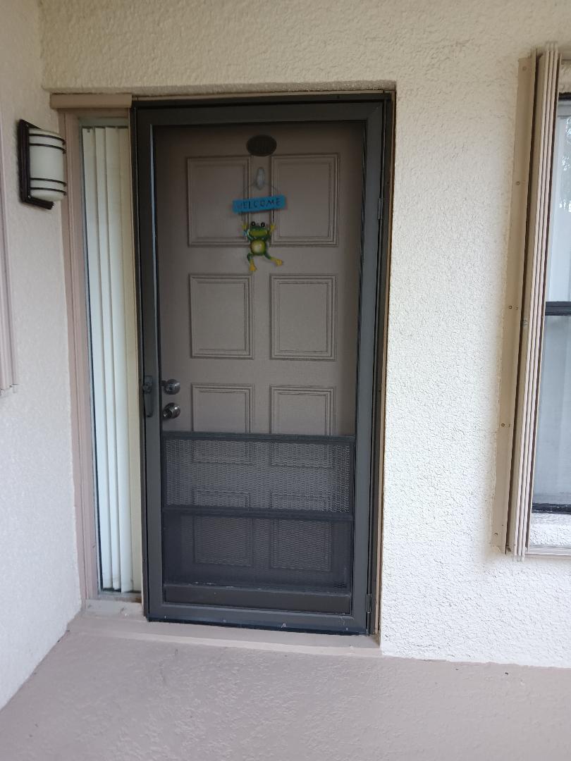 5700 Camino Del Sol, Unit 201 Boca Raton, FL 33433 - Photo 5 of 17 a view of wooden door