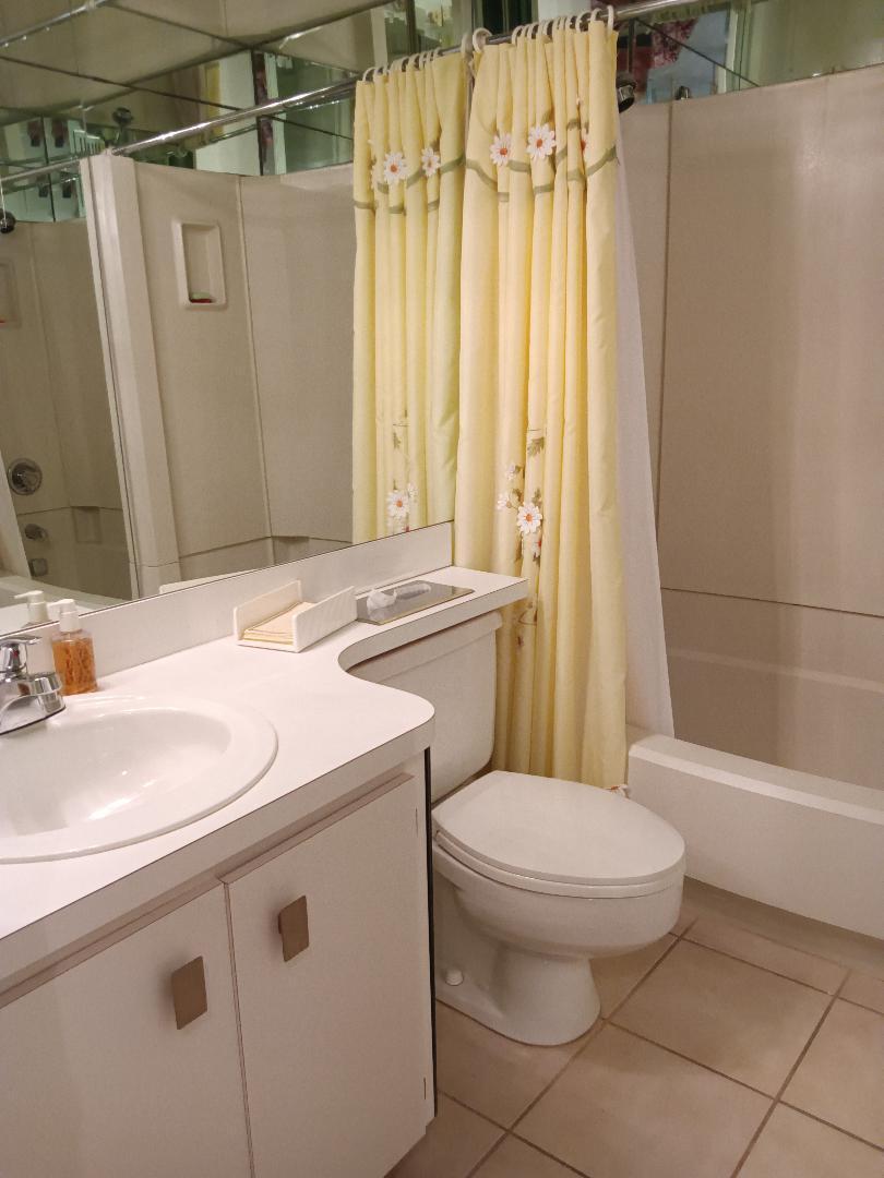 5700 Camino Del Sol, Unit 201 Boca Raton, FL 33433 - Photo 8 of 17 a bathroom with a sink a toilet and shower