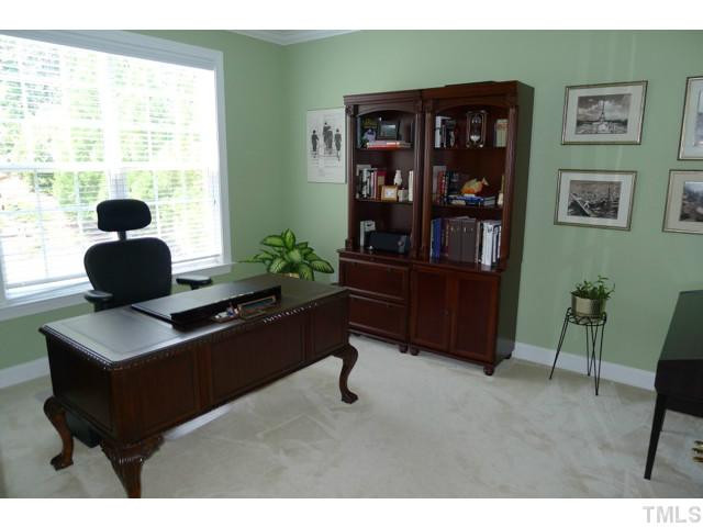 316 Powers Ferry Road Cary, NC 27519 - Photo 12 of 25 Located on the first floor is this spacious office. Accessed with French doors, this room has crown moldings, overlooks the backyard and can alternately be used as a first floor guest room if needed. Studio/Study/Office