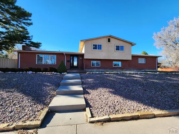 a front view of a house with yard