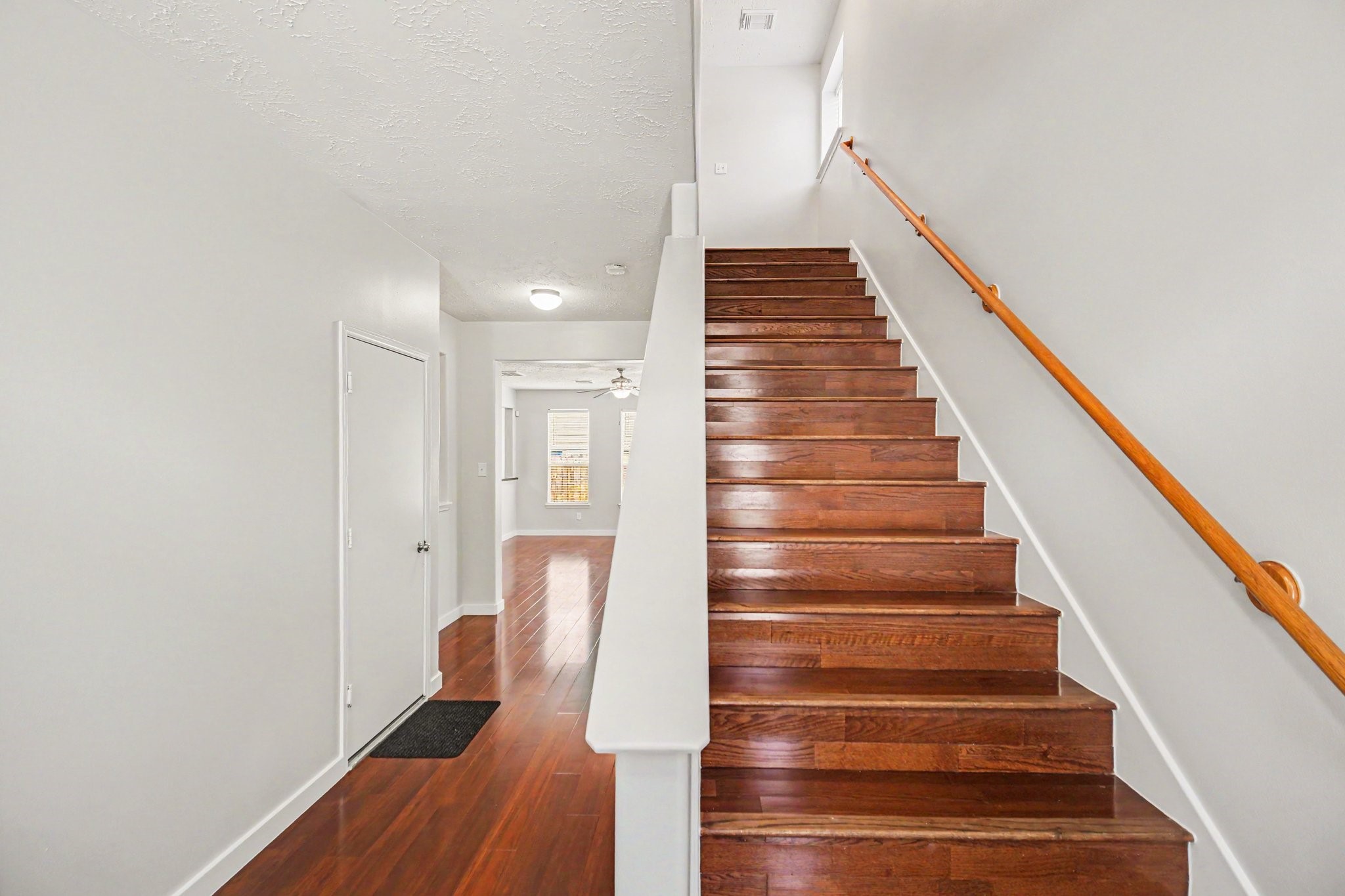 7419 Hollister Ridge Houston, TX 77040 - Photo 2 of 27 This home has a long entryway with garage on left and powder room on right.