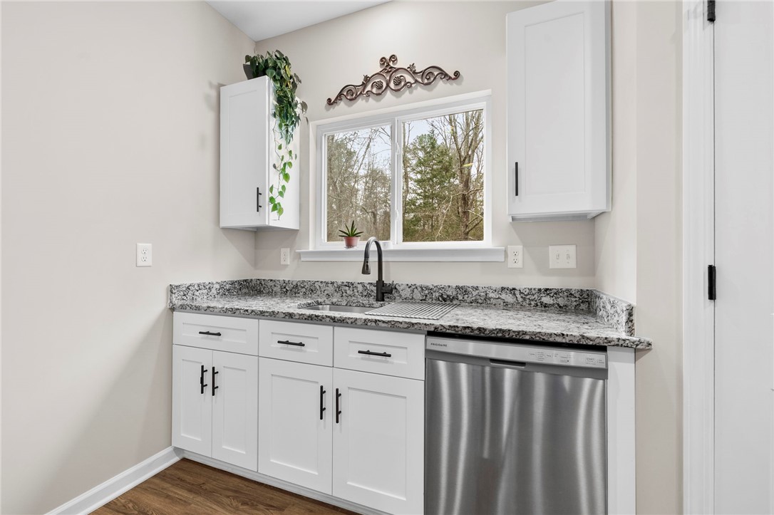 102 Colonial Court Pendleton, SC 29670 - Photo 13 of 30 This bright kitchen features ample counter space and modern appliances, perfect for everyday living.