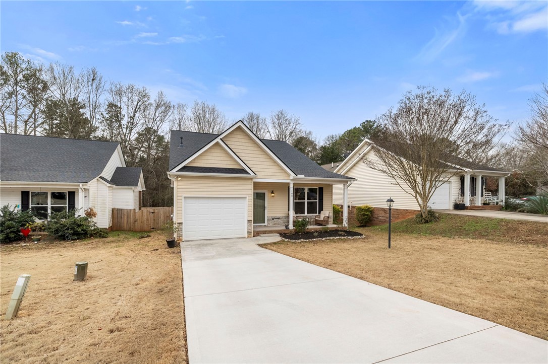 102 Colonial Court Pendleton, SC 29670 - Photo 2 of 30 This charming home offers a convenient driveway and an attached garage.