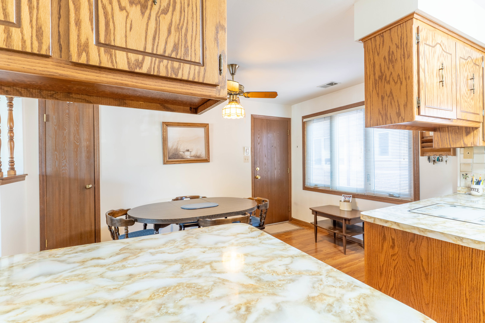 6401 West 64th Place, Unit 2W Chicago, IL 60638 - Photo 13 of 41 a bedroom with a bed a table and chair