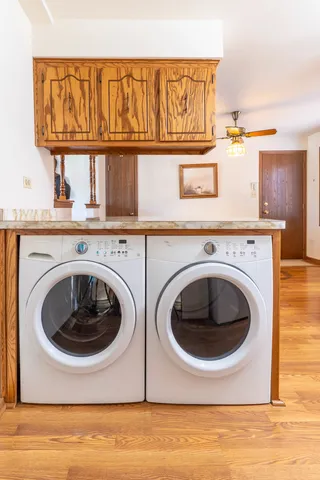 a utility room with sink dryer and washer