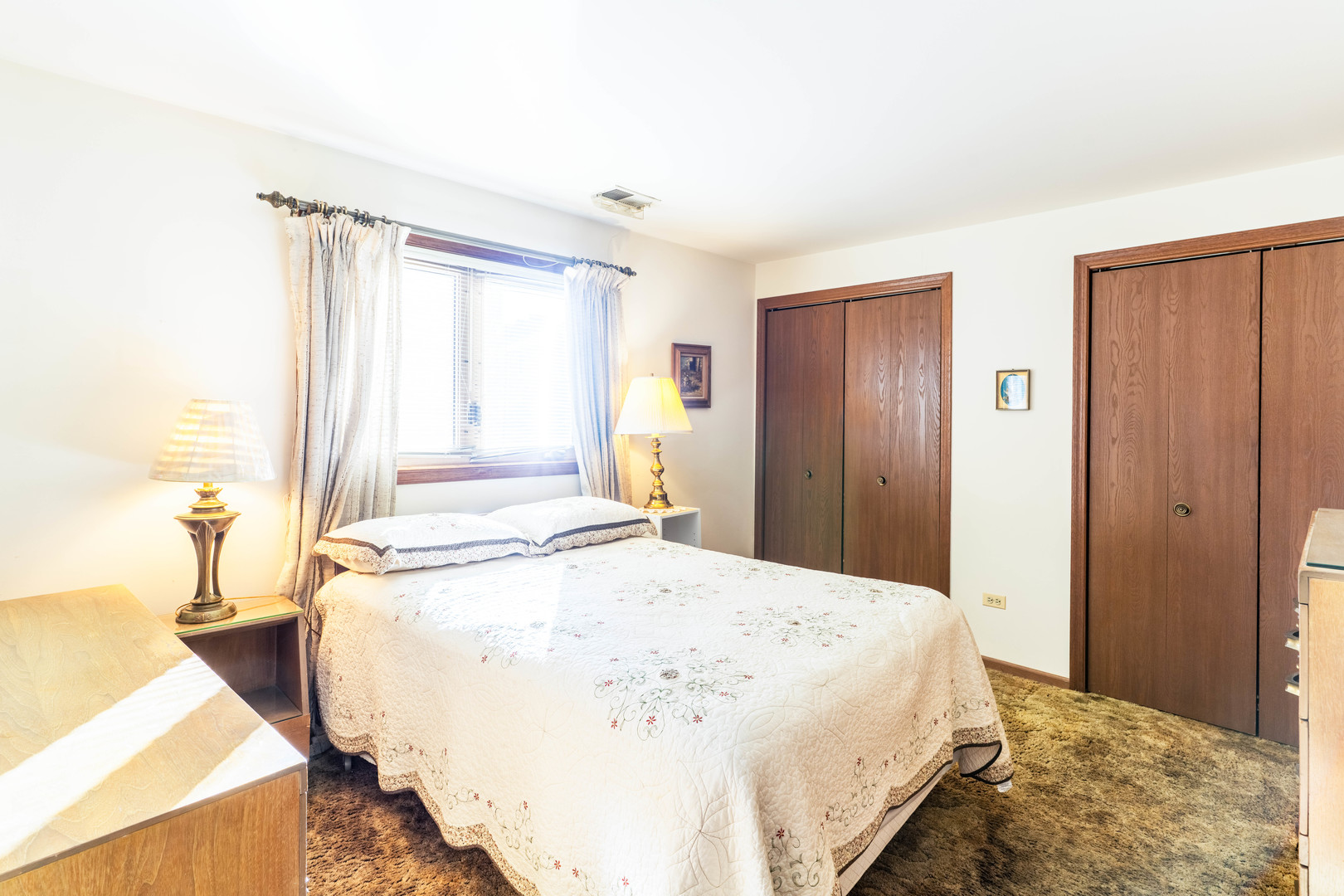 6401 West 64th Place, Unit 2W Chicago, IL 60638 - Photo 16 of 41 a spacious bedroom with a bed and a large window