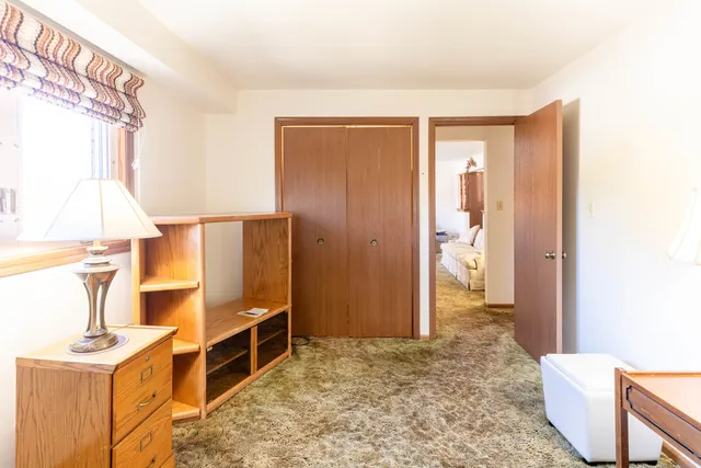 a view of walk in closet with wooden floor