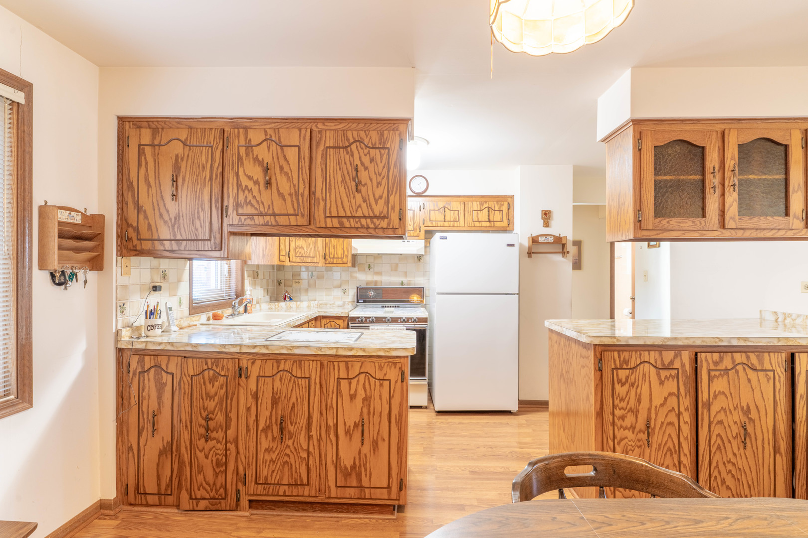 6401 West 64th Place, Unit 2W Chicago, IL 60638 - Photo 10 of 41 a kitchen with a refrigerator and a sink