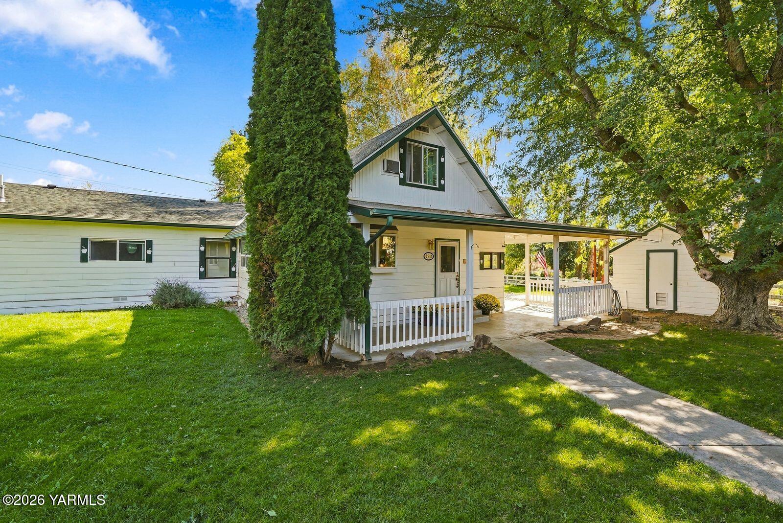 Side yard with back wing of the home