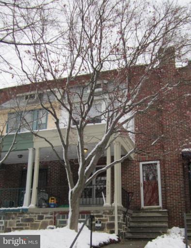 3629 Elkader Road Baltimore, MD 21218 - Photo 1 of 19 front view of a house with a tree