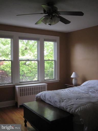 3629 Elkader Road Baltimore, MD 21218 - Photo 5 of 19 a bedroom with a bed and a window
