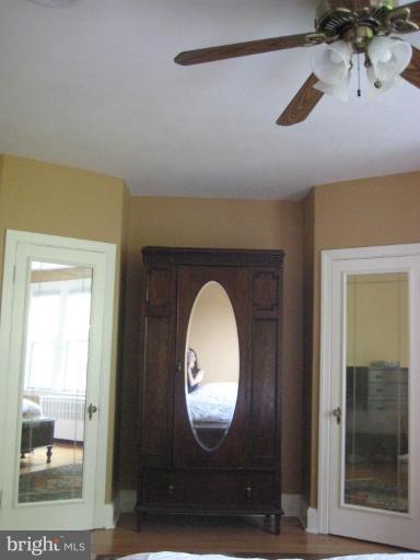 3629 Elkader Road Baltimore, MD 21218 - Photo 6 of 19 a view of a livingroom with wooden floor and a large window