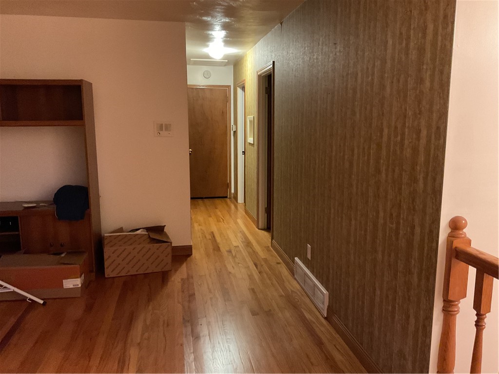 993 Linden Avenue Decatur, IL 62522 - Photo 6 of 7 a view of a hallway with wooden floor and closet