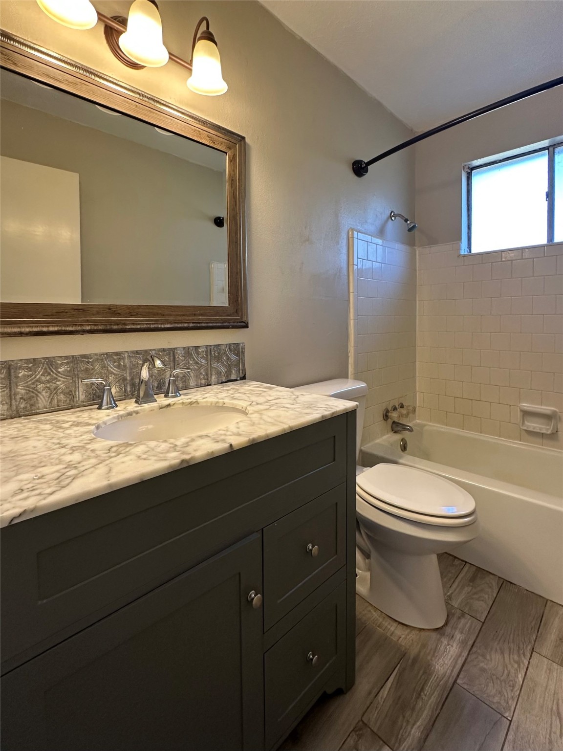 3223 Brooktree Lane Spring, TX 77380 - Photo 14 of 30 a bathroom with a granite countertop toilet sink and mirror