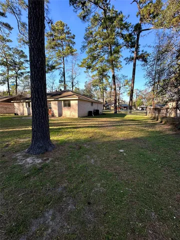 a view of a house with a big yard