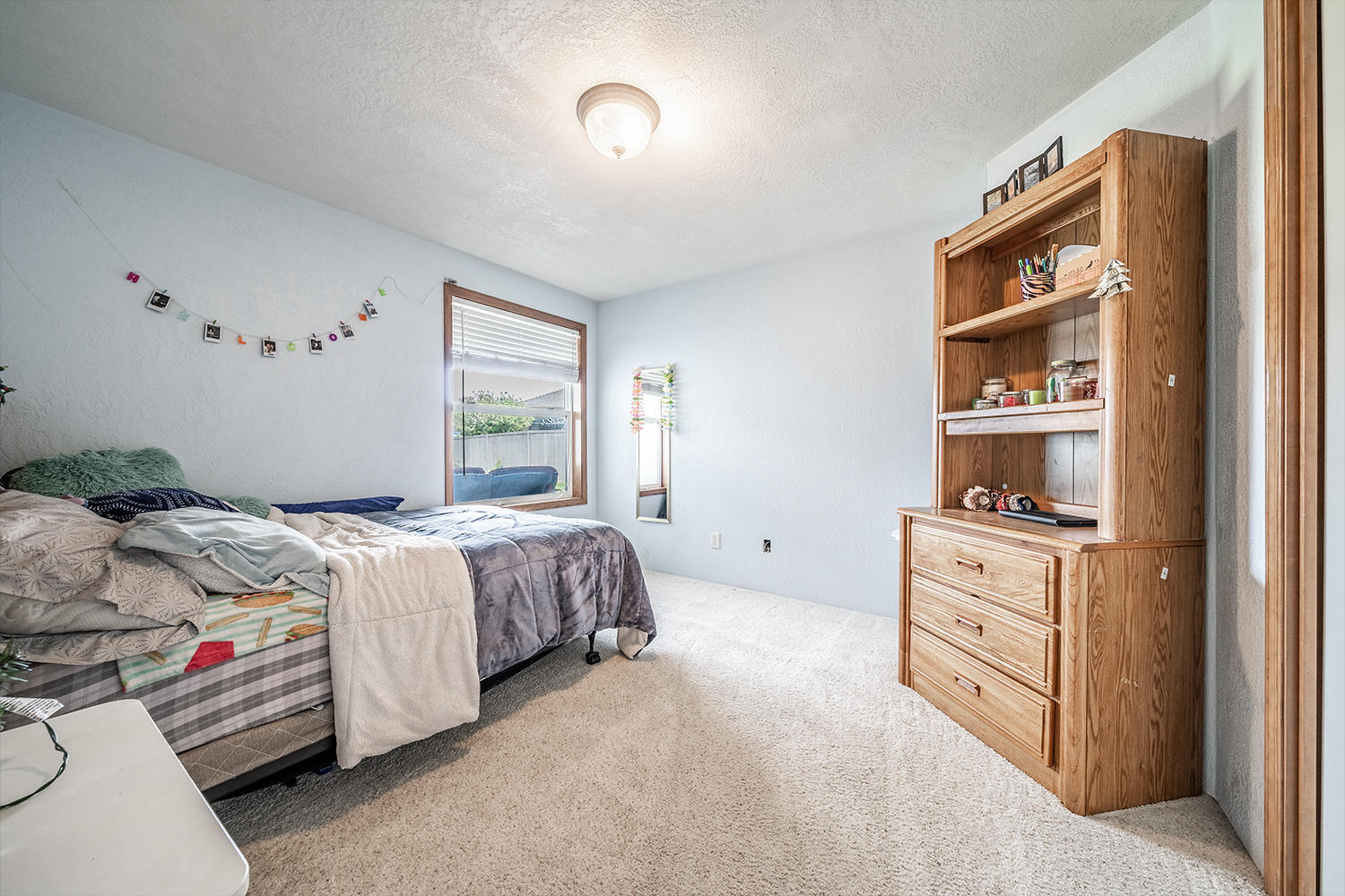 2628 Beebe Road Central Point, OR 97502 - Photo 18 of 27 a bedroom with a bed and a window