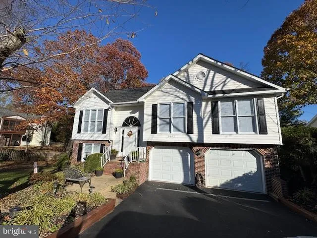 a front view of a house with yard porch and sitting area
