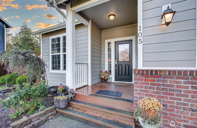 a front view of a house with outdoor seating