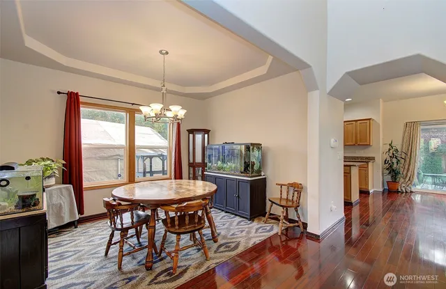 a view of a dining room with furniture window and wooden floor