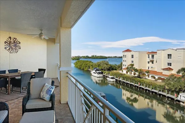 a view of a balcony with furniture