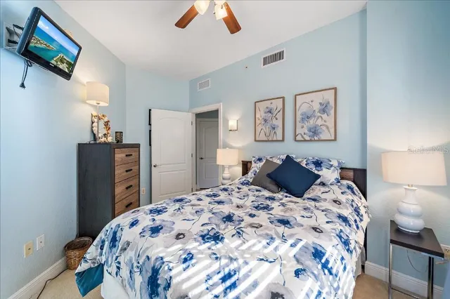 a bedroom with a bed and a dresser