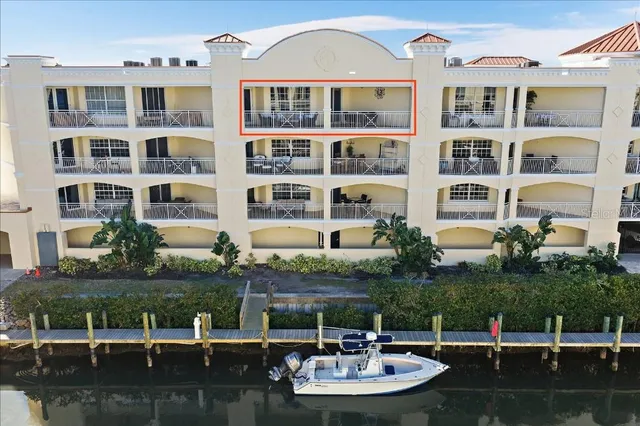 a view of house with lake view and a garden