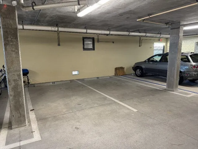 a view of walk in closet with clothes