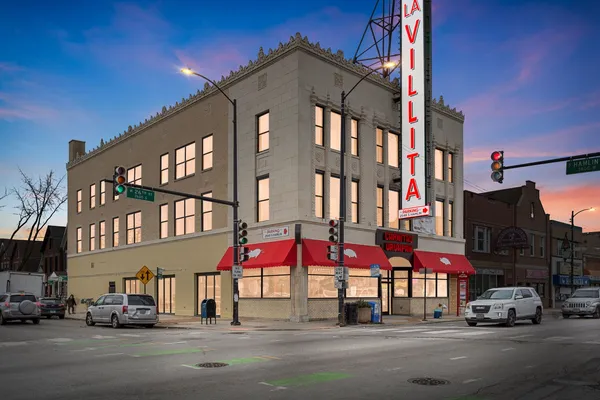 a view of a building with traffic signal lights