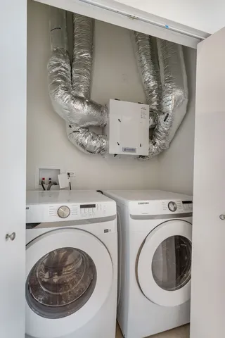 a utility room with dryer and washer