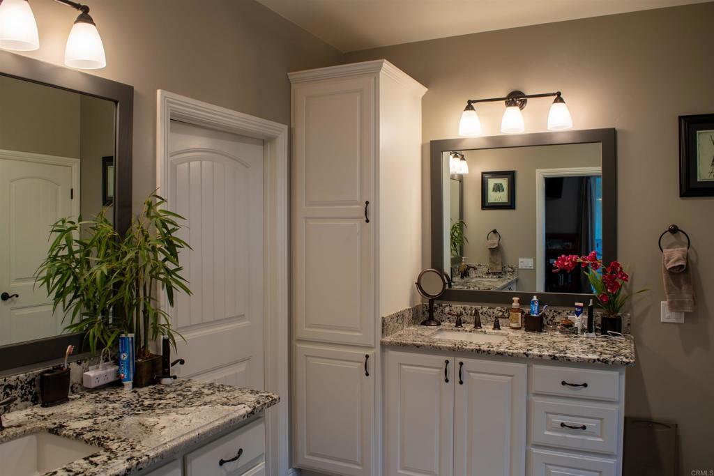 2521 Ralls Street Fallbrook, CA 92028 - Photo 28 of 43 a bathroom with a sink and a mirror