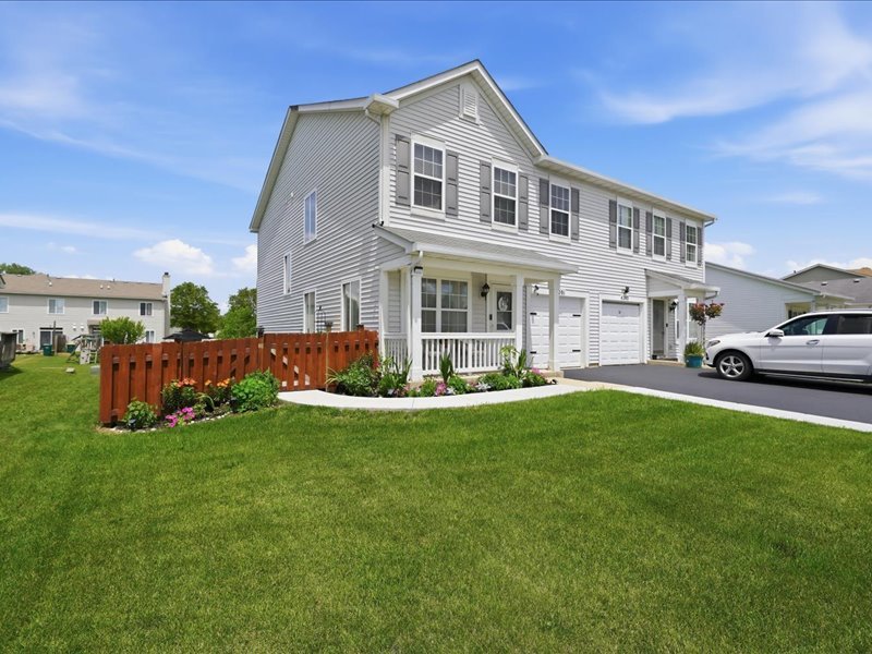 4201 Dillon Street Plano, IL 60545 - Photo 2 of 37 a front view of a house with a yard