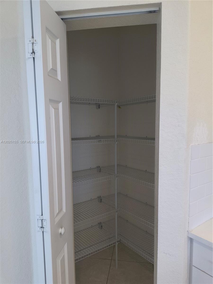 1645 Southeast 20th Road, Unit 1645 Homestead, FL 33035 - Photo 5 of 20 a view of a walk in closet