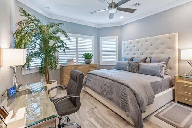 a view of a dining room with furniture a rug and wooden floor