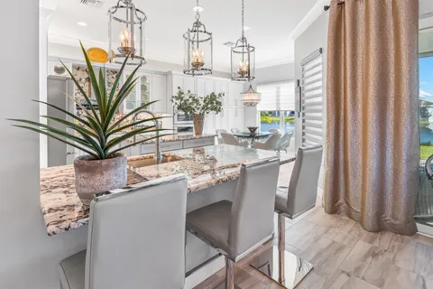 a kitchen with stove and refrigerator