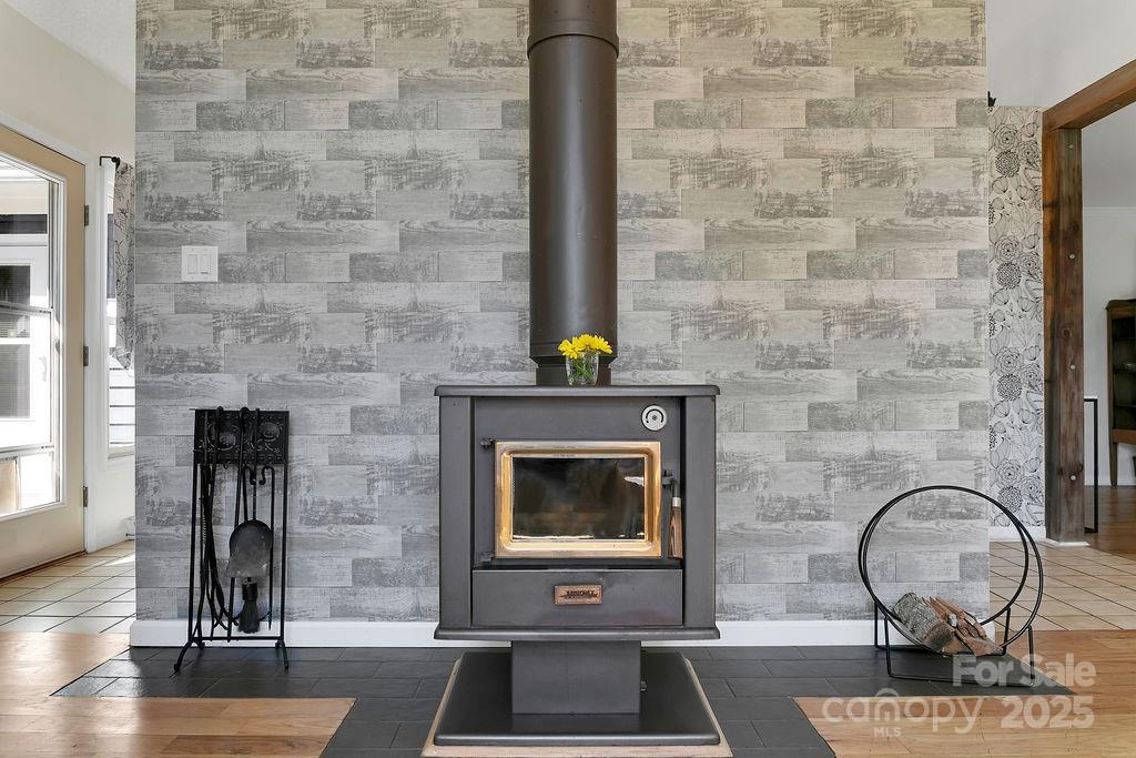 1881 Becky Mountain Road Brevard, NC 28712 - Photo 11 of 40 a front view of a fireplace with wooden floor
