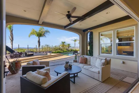 a kitchen with stainless steel appliances granite countertop a stove top oven a sink dishwasher a dining table and chairs