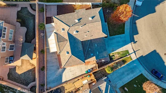 an aerial view of a house with wooden stairs