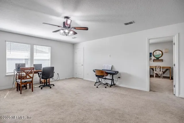 a living room with furniture and a rug