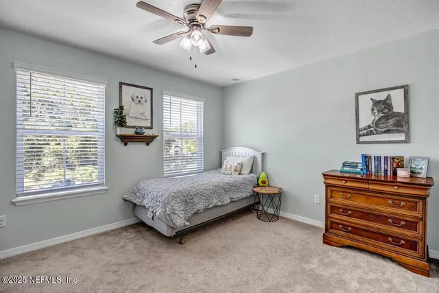 a view of a livingroom with workspace and a window