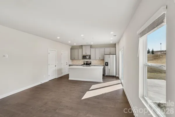 a view of kitchen with white cabinets