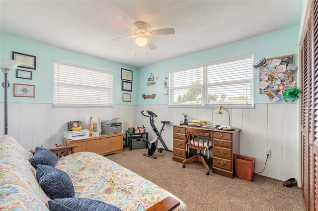 a bedroom with furniture and a window