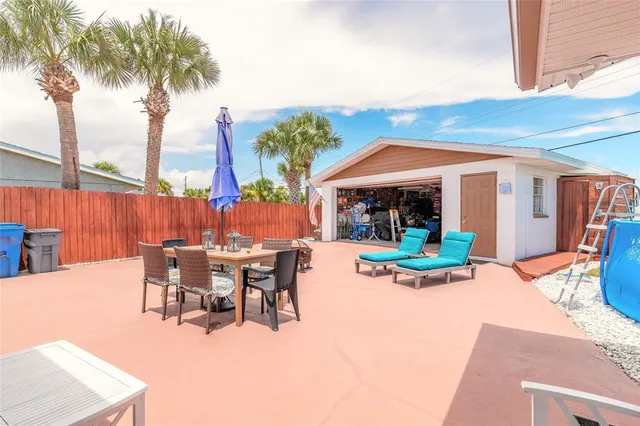 a view of a sitting area with furniture and backyard