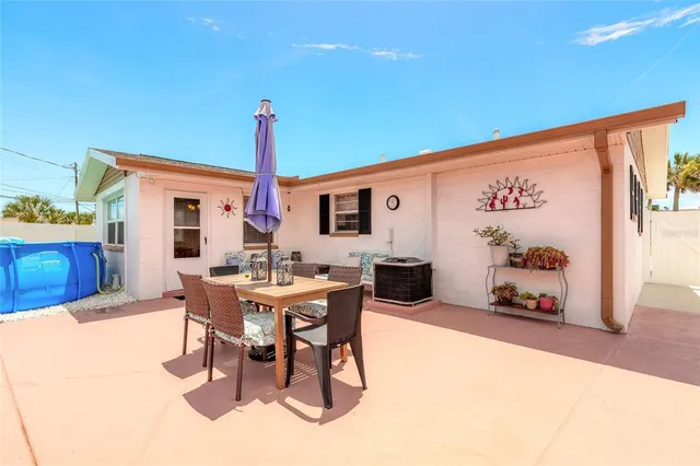 a view of a dining room with furniture window and outdoor kitchen