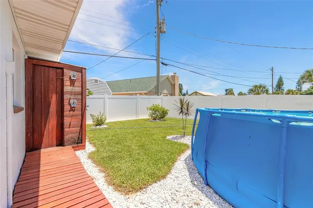 a view of a house with a backyard