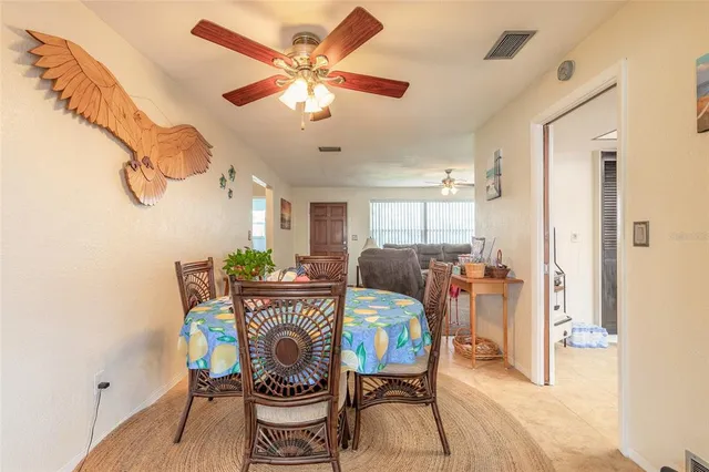 a view of a dining room and hall with furniture